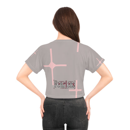 Back view of a woman wearing a pink cross graphic crop tee for women, featuring the word &